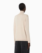 Back view of Kiku beige high-neck knit with long sleeves