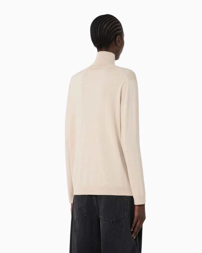 Back view of Kiku beige high-neck knit with long sleeves