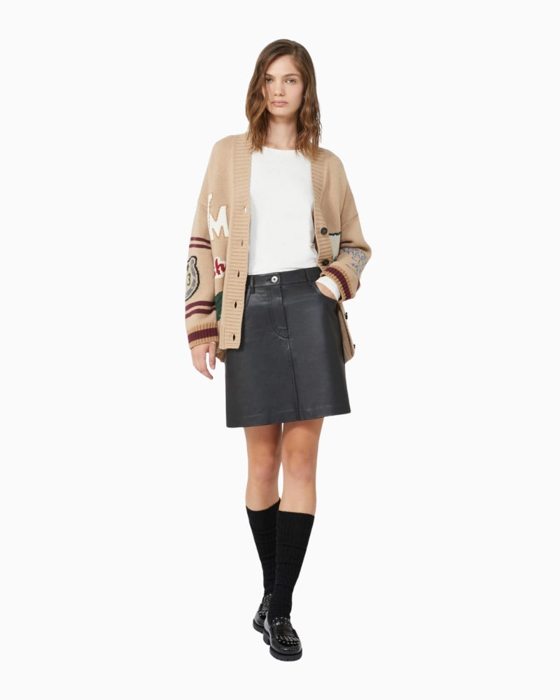 Outfit styled with printed blazer over cream stretch top