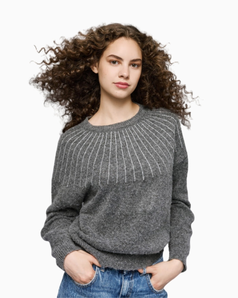 Detail of shoulder rhinestones on grey knit top