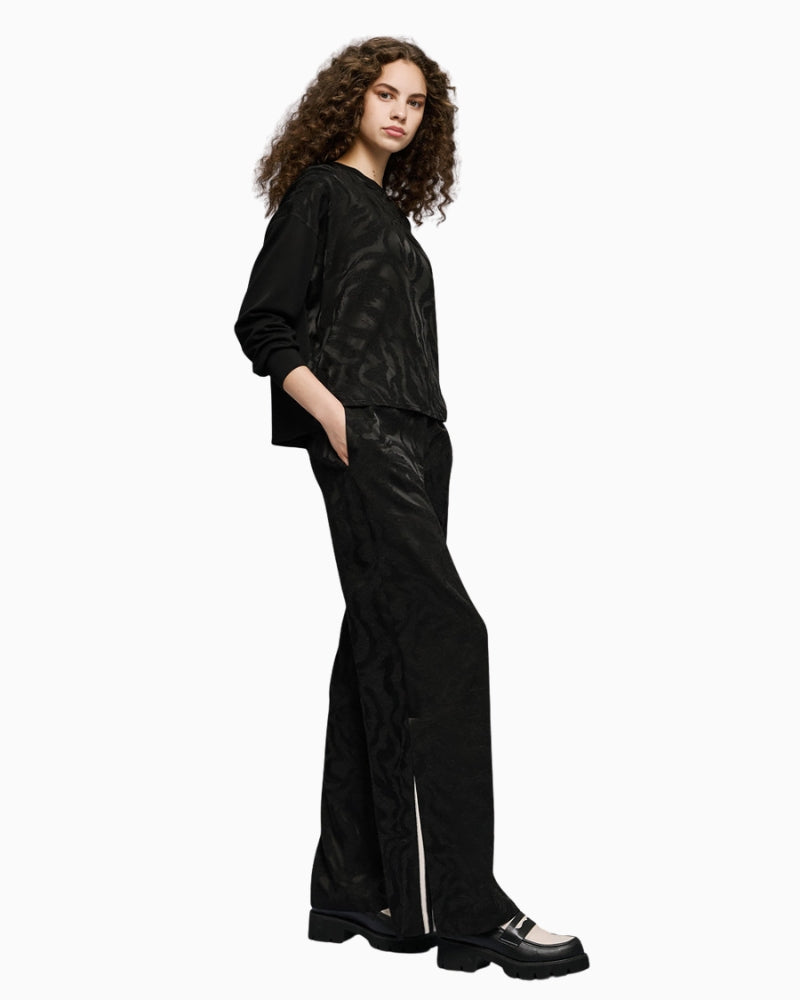 Full look with model wearing black Access jacquard blouse and matching trousers