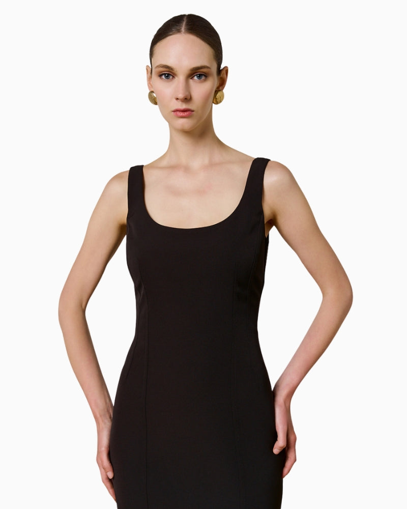 Front view of black midi pencil dress with decorative seam detail