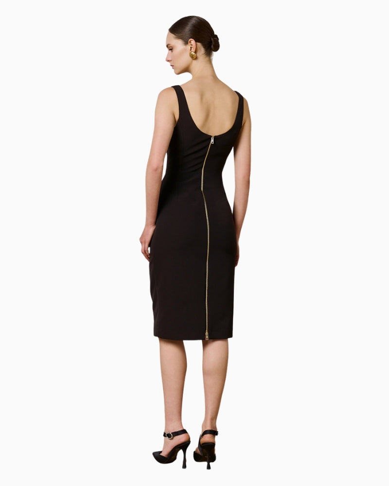 Back view of black pencil dress with back zip closure and slit
