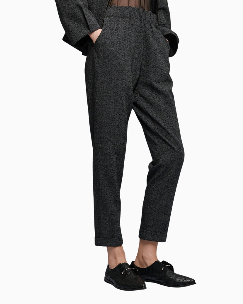 Side view of Access rhinestone pants showing silhouette and waistband