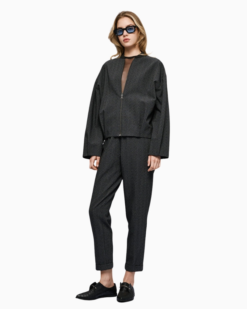 Full look with model wearing dark grey rhinestone pants by Access and matching blouse