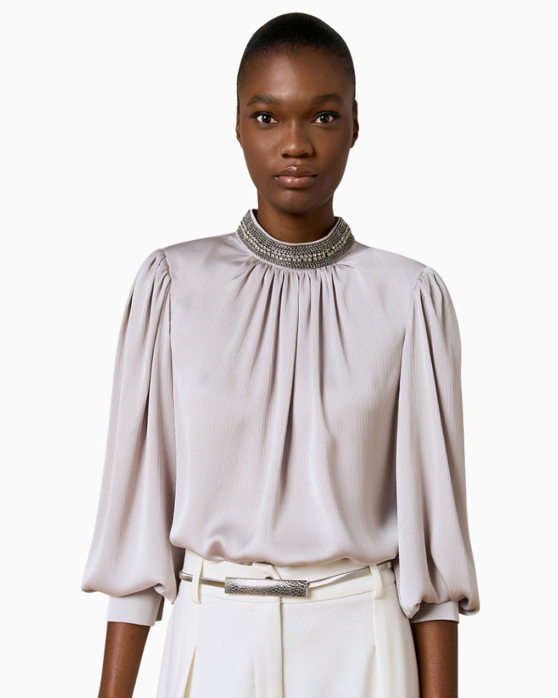 Front view of Silver Shimmery Blouse with long sleeves, padded shoulders and side slits