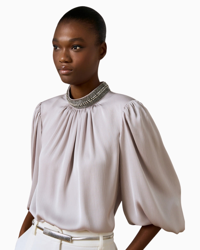 Fabric detail of shimmery embossed Silver Blouse by Access with elegant textured finish