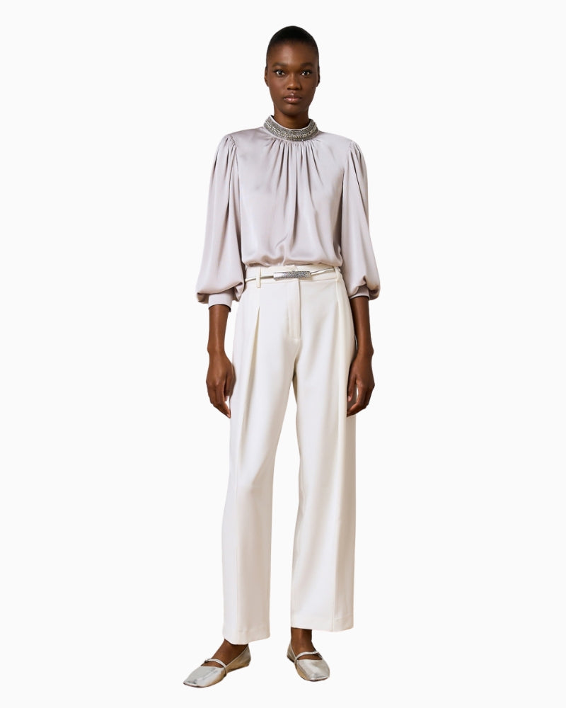 Full look with model wearing Silver Shimmery Blouse by Access with rhinestone high neckline