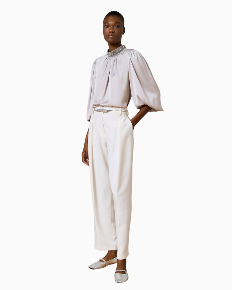 Side view of Access Silver Blouse showing shimmery embossed fabric and relaxed fit