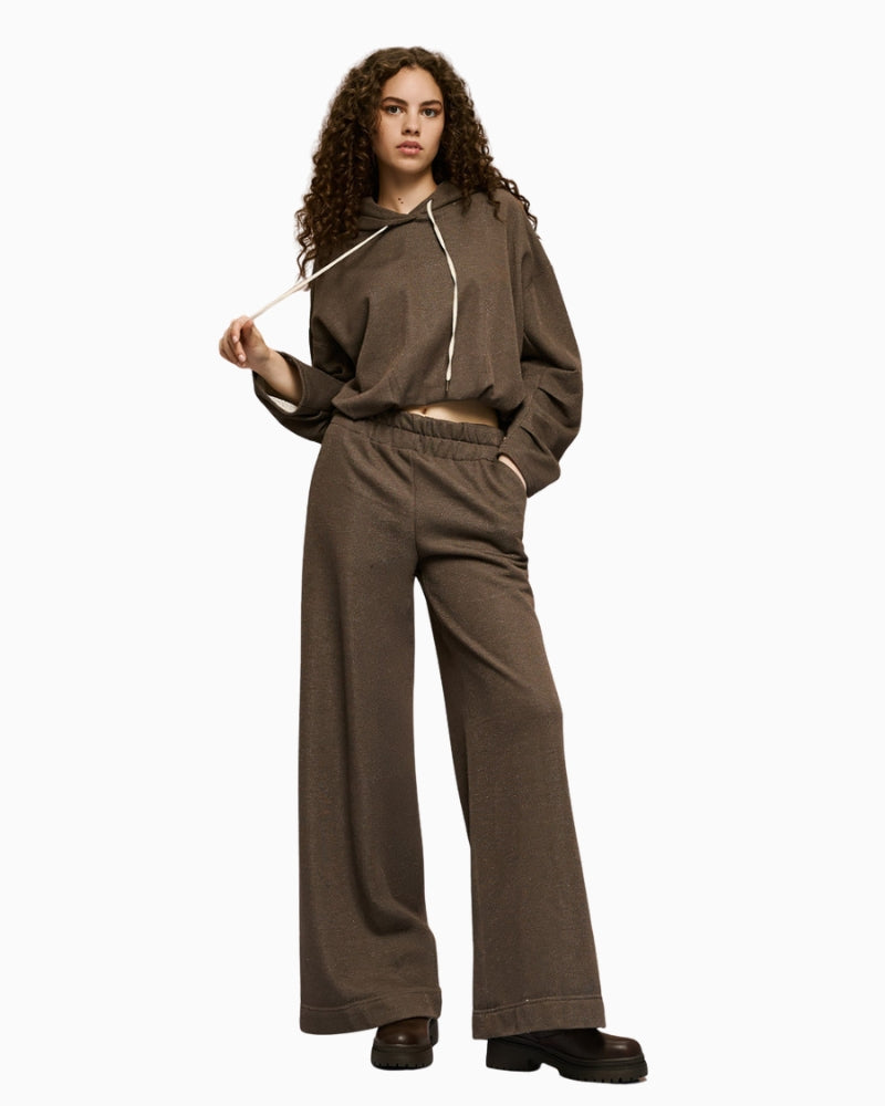 Full look with model wearing brown wide-leg pants by Access with matching top