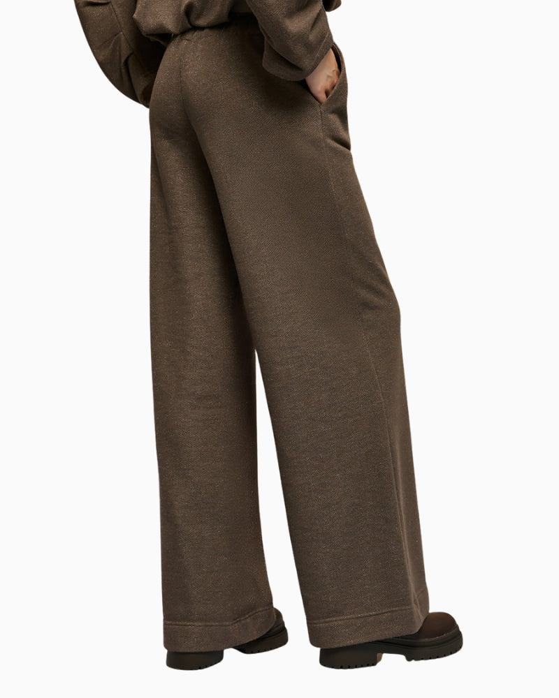 Back view of brown wide-leg trousers with smooth finish