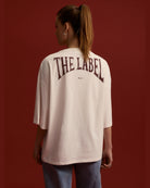 Back view of Alix white tee showing bold logo on heavy jersey fabric
