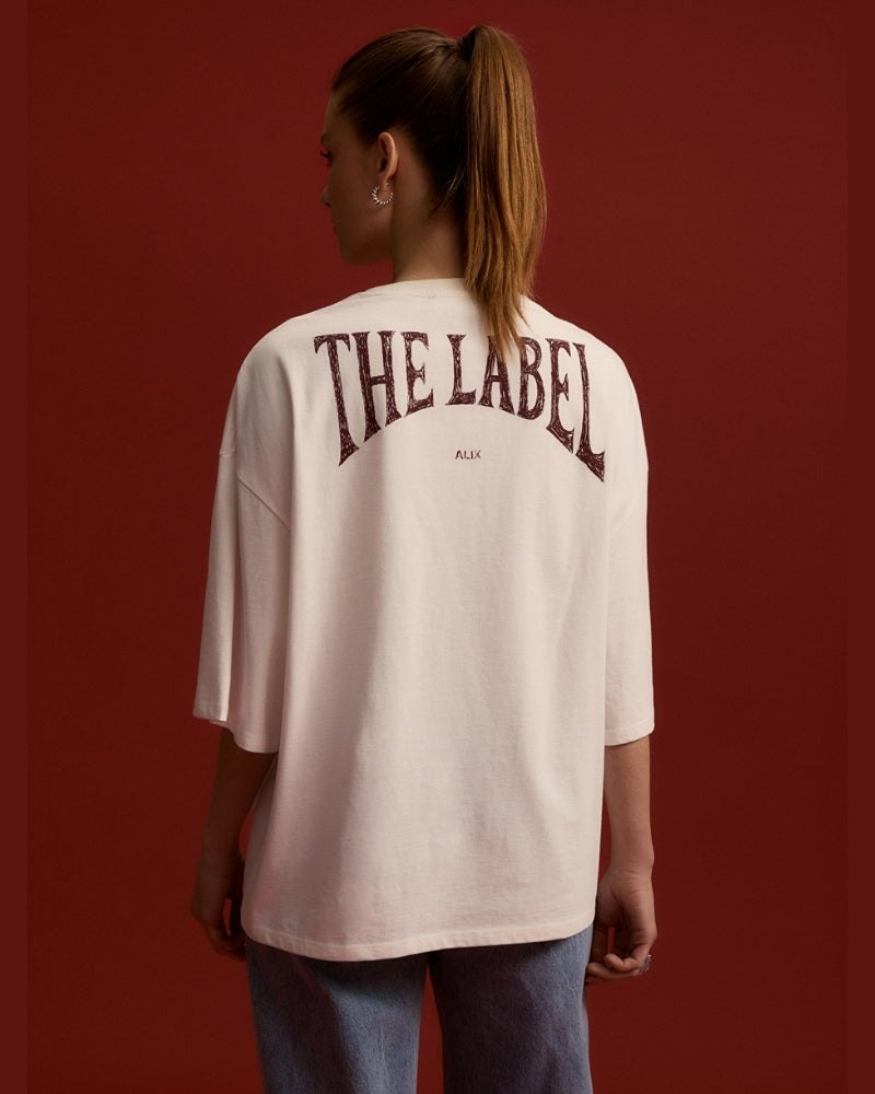 Back view of Alix white tee showing bold logo on heavy jersey fabric