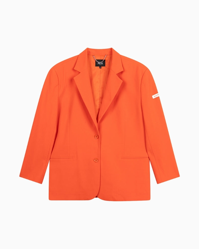 Front view of Alix orange suit jacket with relaxed oversized fit