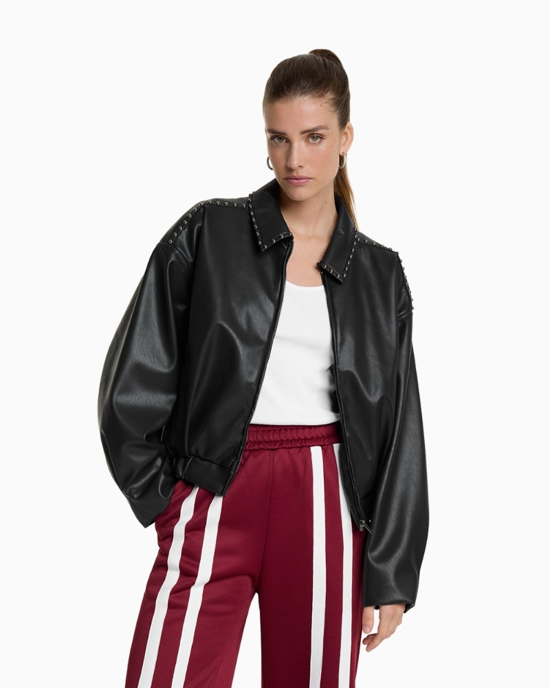 Black faux leather bomber by ALIX The Label with studded shoulders and cropped fit