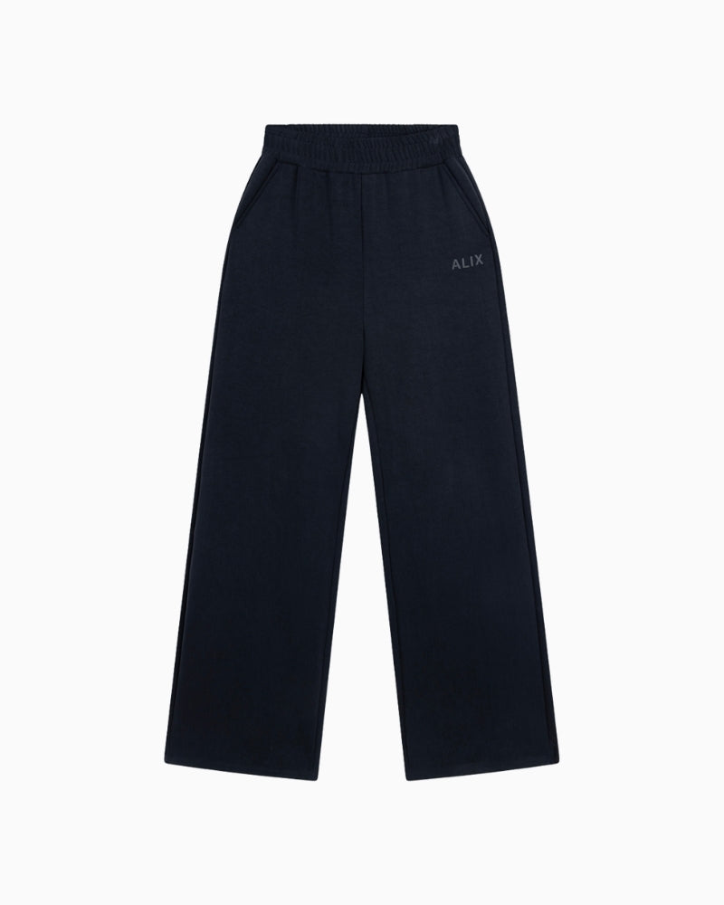 Front view of Alix black trousers with elastic waistband and relaxed fit