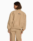 Back view of Alix logo jacket showing bold embroidered bull design