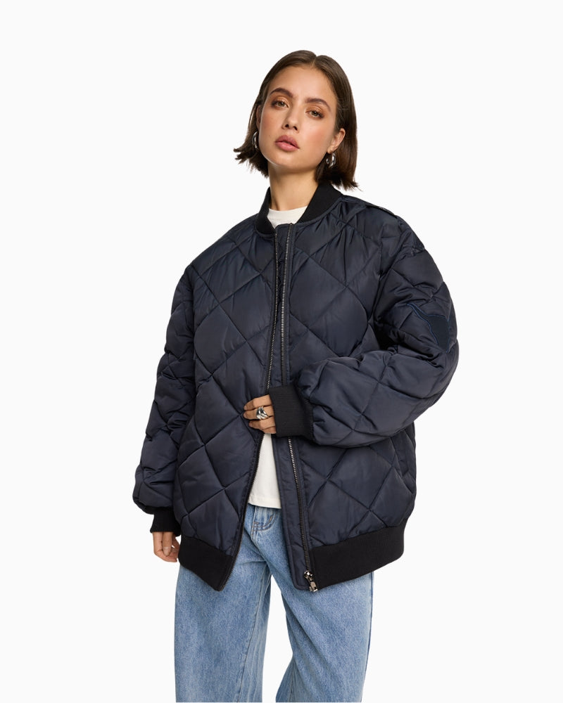 Navy quilted bomber jacket by ALIX The Label with ribbed collar and zip front