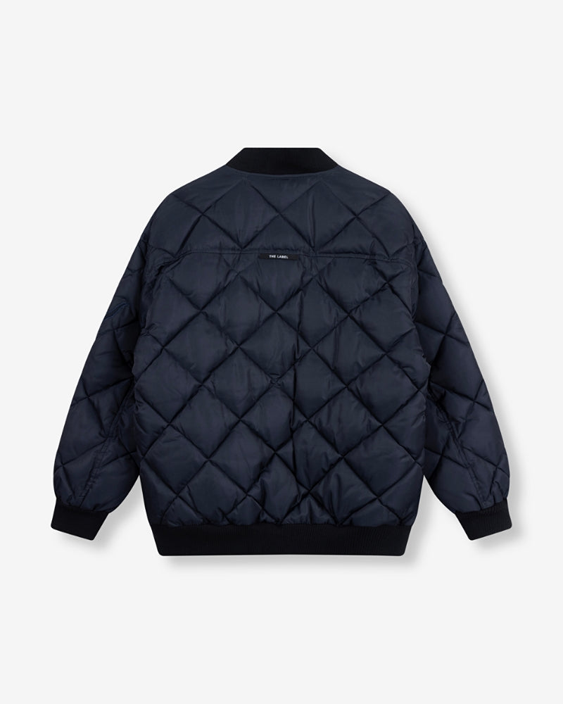 Back view of oversized ALIX bomber showing logo detail and hip-length fit