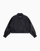 Back view of ALIX blouse showing 'THE LABEL' artwork and studded design