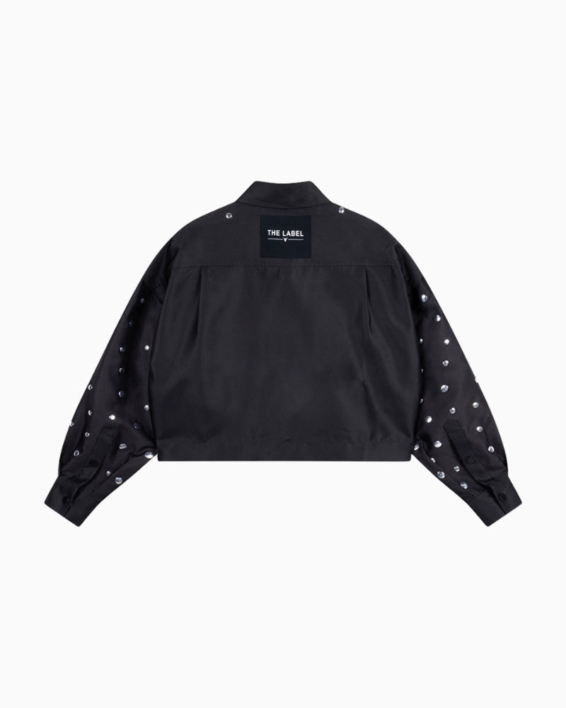 Back view of ALIX blouse showing 'THE LABEL' artwork and studded design