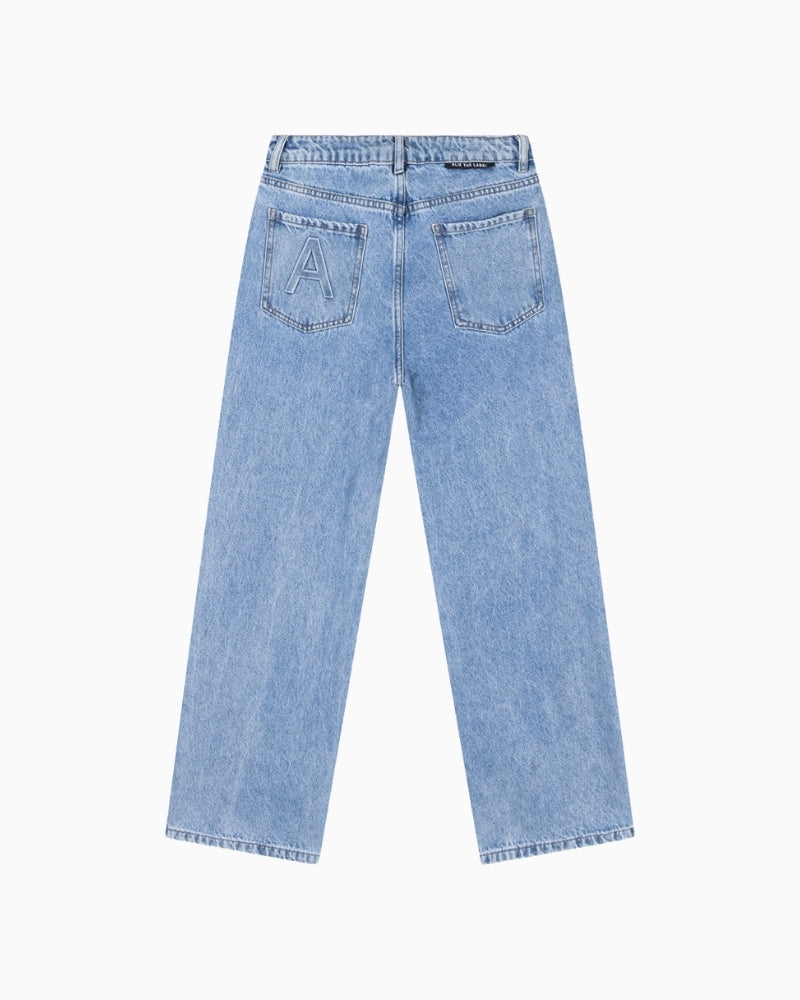 Back view showing ‘A’ embroidery on pocket of denim blue jeans