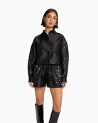 Black satin studded shorts by ALIX The Label with drawstring waist