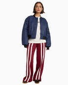 Alix The Label bordeaux sweat pants with wide-leg cut and stripe detail
