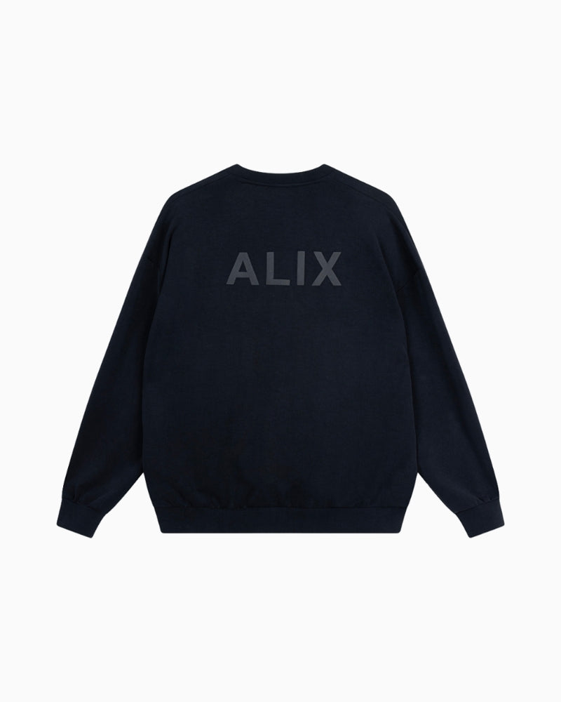 Back view of Alix V-neck sweater showing subtle ALIX artwork