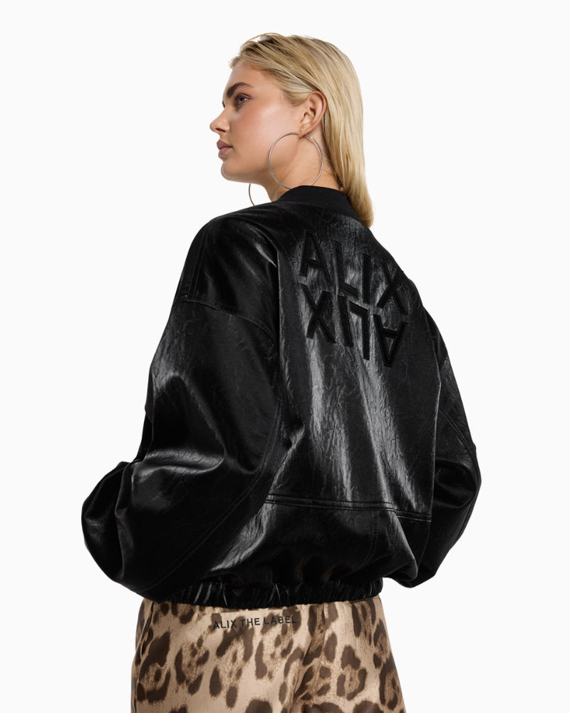 Back of ALIX bomber jacket featuring mirrored ALIX logo and cracked leather texture