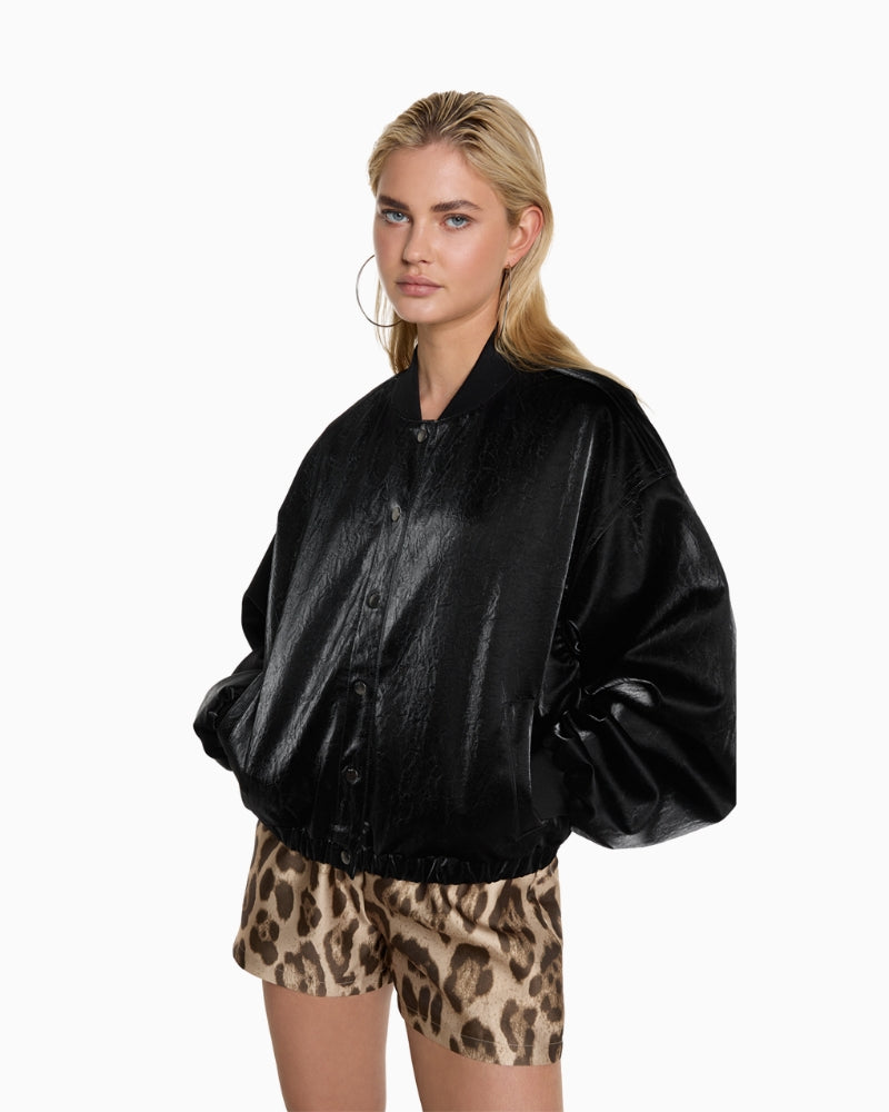 Model wearing ALIX black velvet leather bomber jacket with round neckline and long sleeves