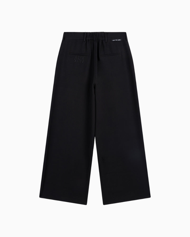 Back view of Alix wide-leg pants with elastic waistband and embroidery