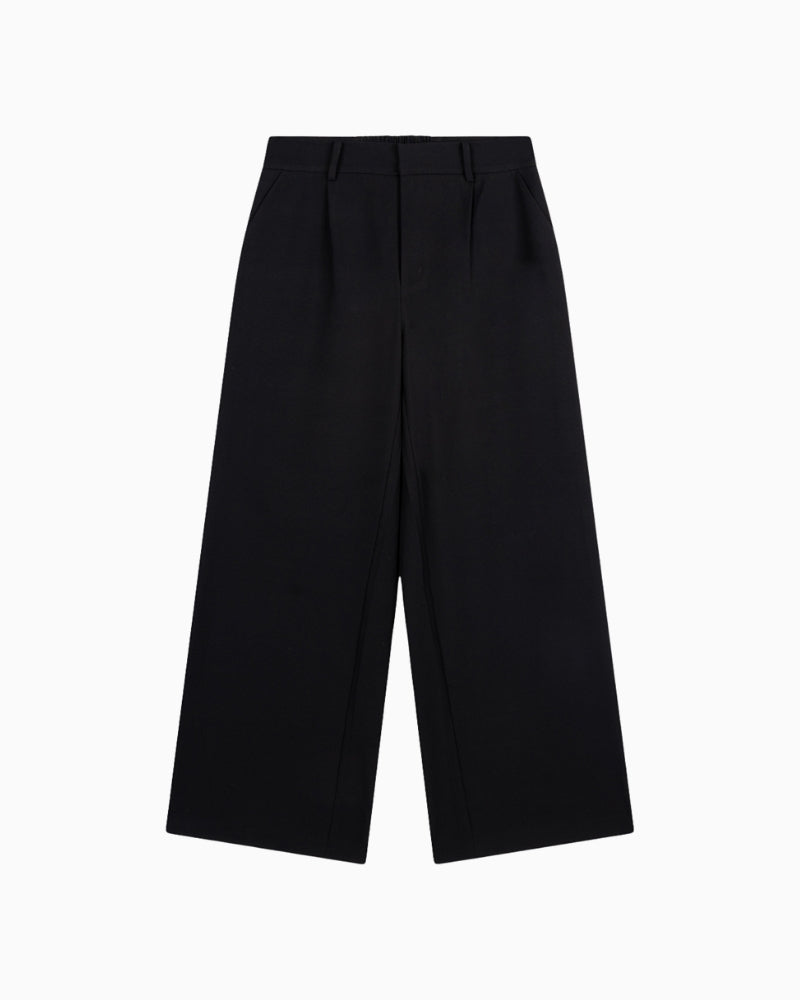 Front view of Alix tailored trousers in black with zip and hook closure