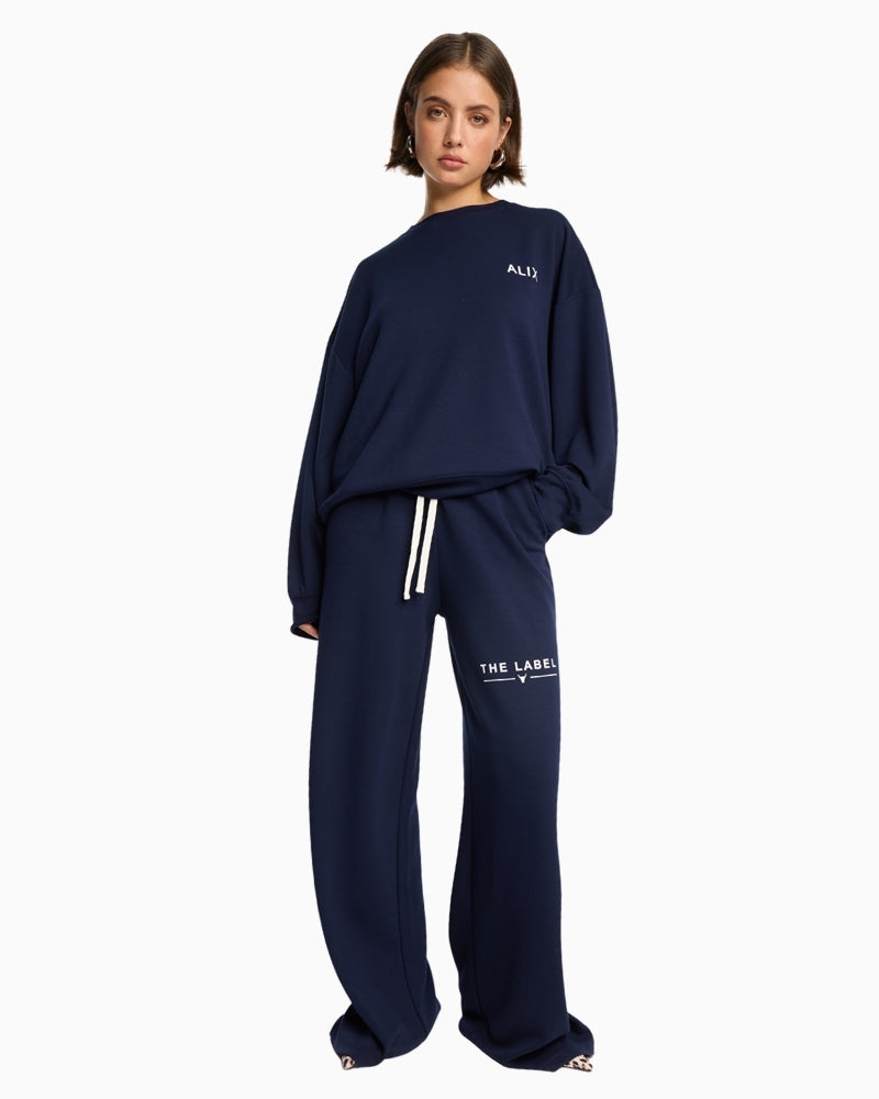 Alix The Label navy scuba pants with wide-leg cut and drawstring waistband