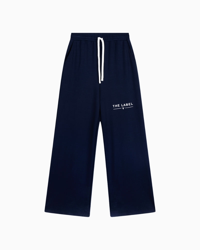 Front view of navy scuba trousers with elastic waist and pockets