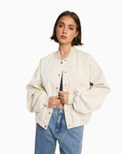 Cream faux velvet leather bomber jacket by ALIX The Label with zip front
