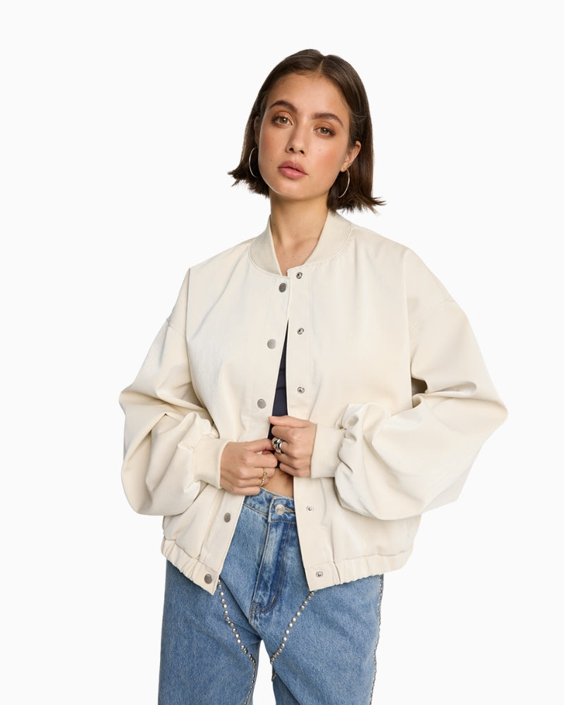 Cream faux velvet leather bomber jacket by ALIX The Label with zip front
