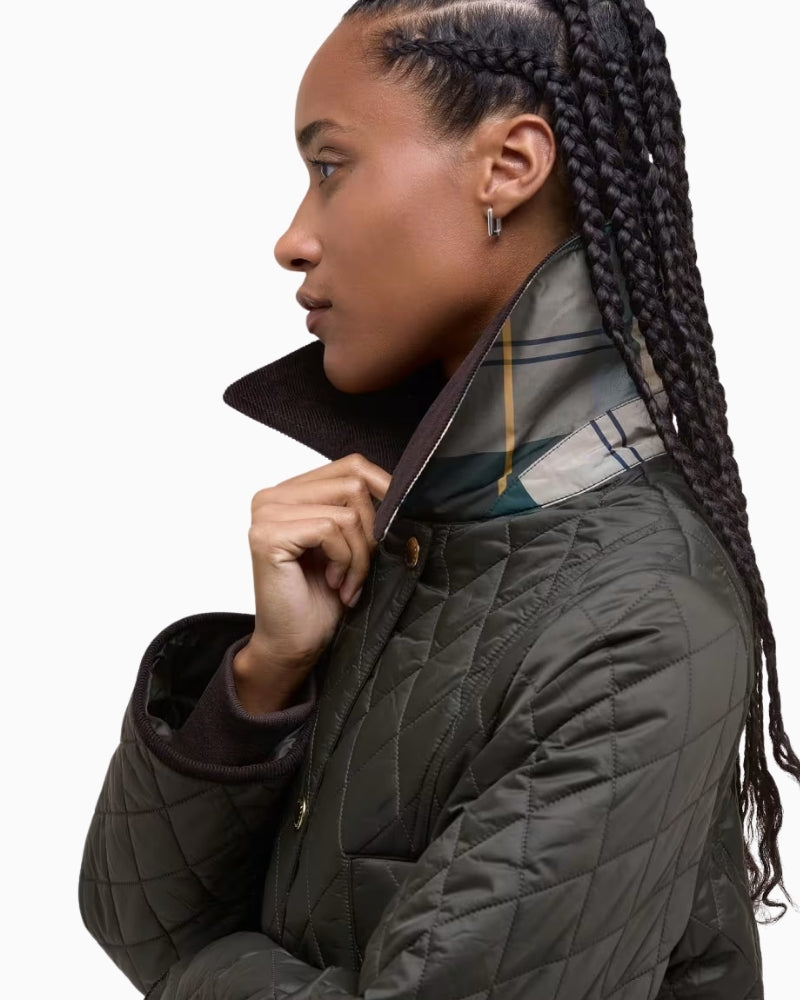 Side view of Barbour quilted jacket showing modern fit and clean seam lines
