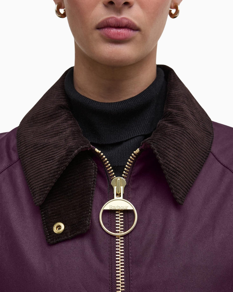 Detail of chunky metal zip and rustic waxed cotton texture on Barbour Arlene jacket