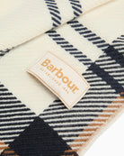 Close up view of Barbour scarf showing brand label