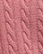 Close-up of the cable knit detail and soft wool texture