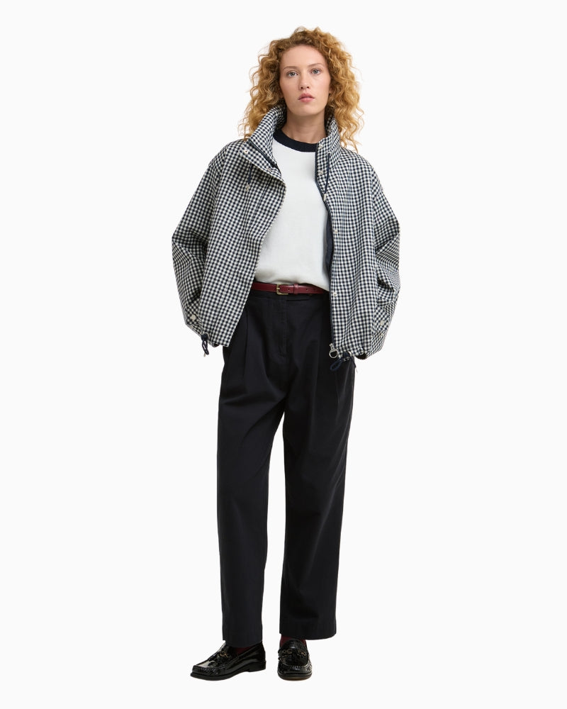 Woman wearing Barbour Bronwyn check showerproof jacket navy outdoor – Áines Boutique