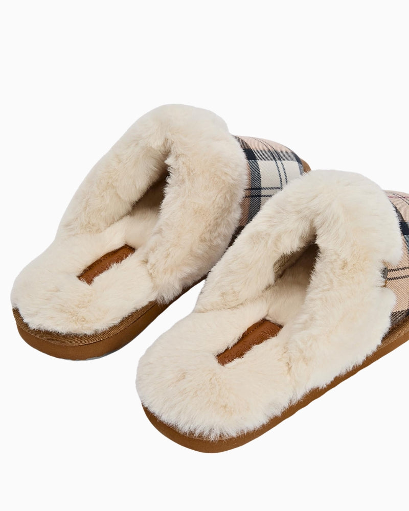 Close-up of Barbour branded ID bar on Claudia mule slippers