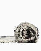 Rolled monochrome tartan Barbour scarf with woven brand label