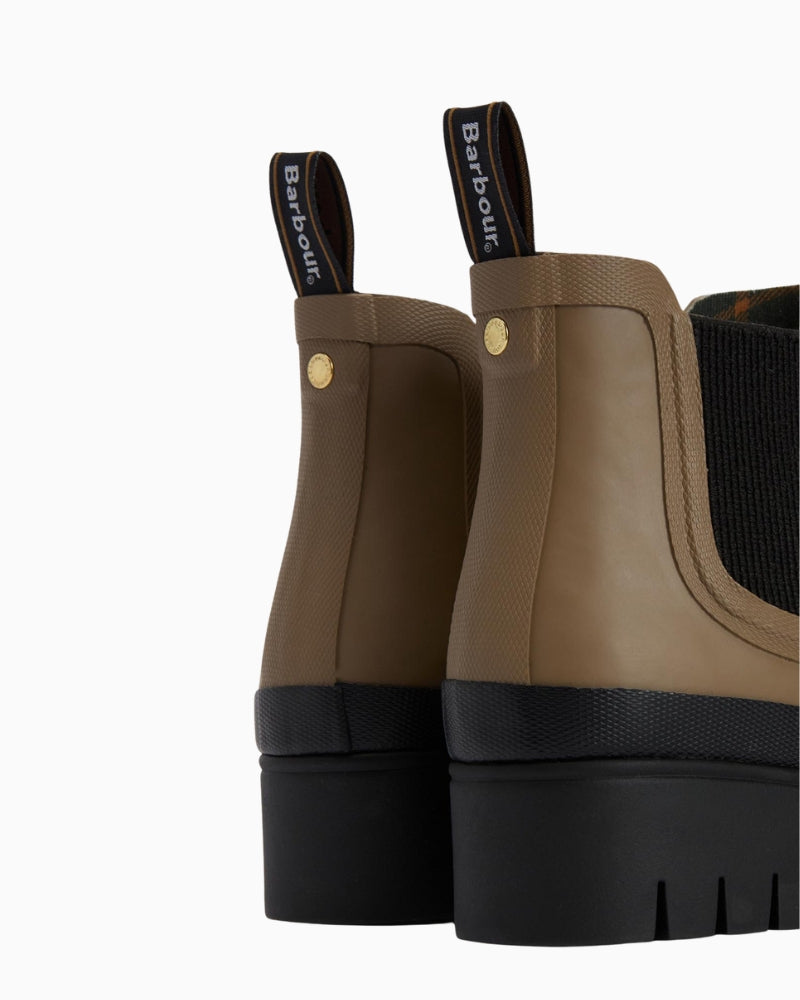 Close-up of chunky rubber lug sole on Halton ankle wellies showing tread grip