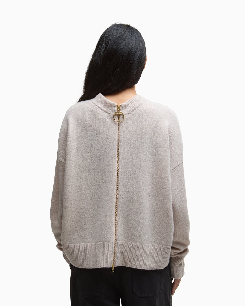 Back view showing unique zip detail and leather trim