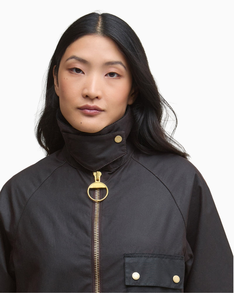 Close-up of gold zip and snap buttons on Luella jacket