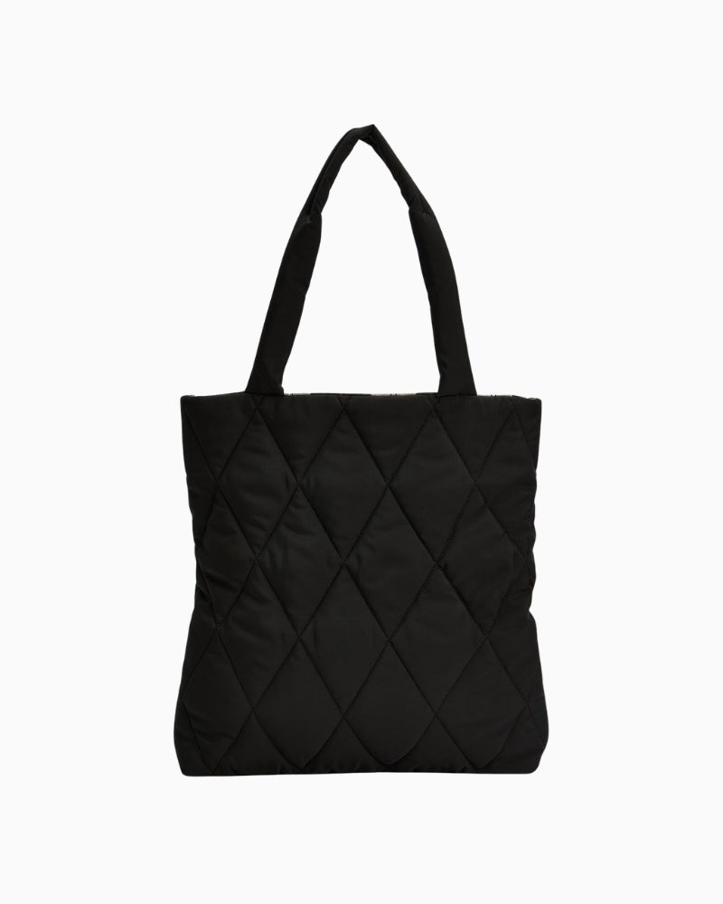 Back view of Barbour black quilted tote bag with slim rectangular shape and long handles