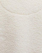 Zoomed-in image of soft fleece fabric texture in natural colour