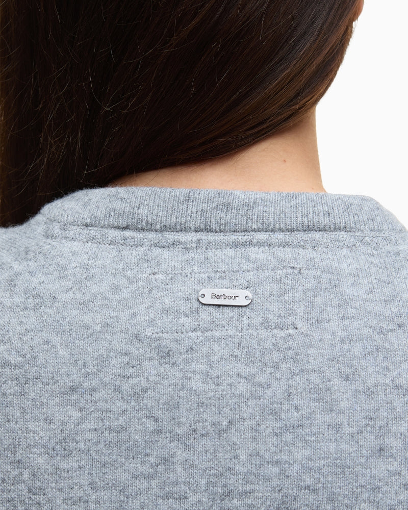 Close-up of Barbour logo stitched at neckline on the back panel